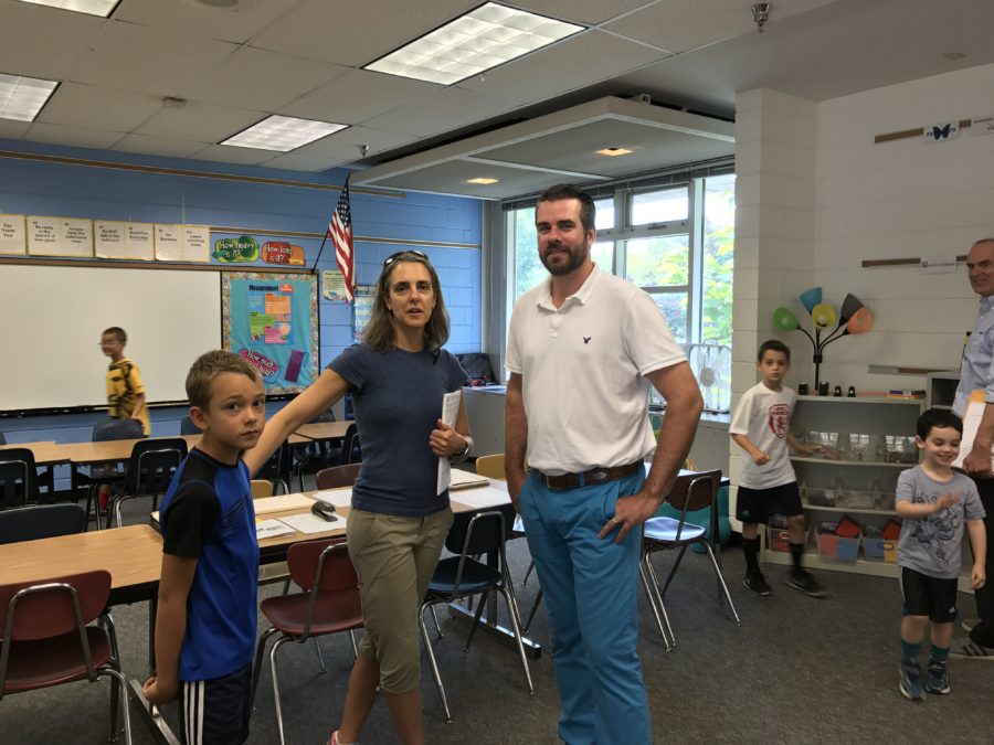 student and teacher at the open house