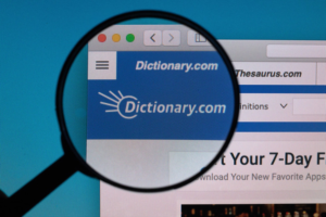 Screenshot_2020-05-26 Dictionary com logo under magnifying glass