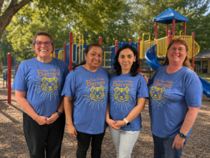 PreK Team with playground in the background.