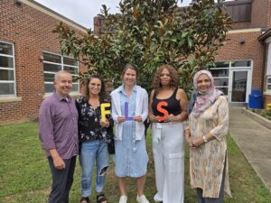 Functional Life Skills Teaching Team posing in the Outdoor Classroom