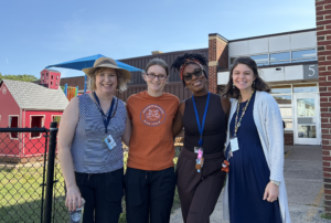 2nd Grade Teachers Outside by the playground smiling